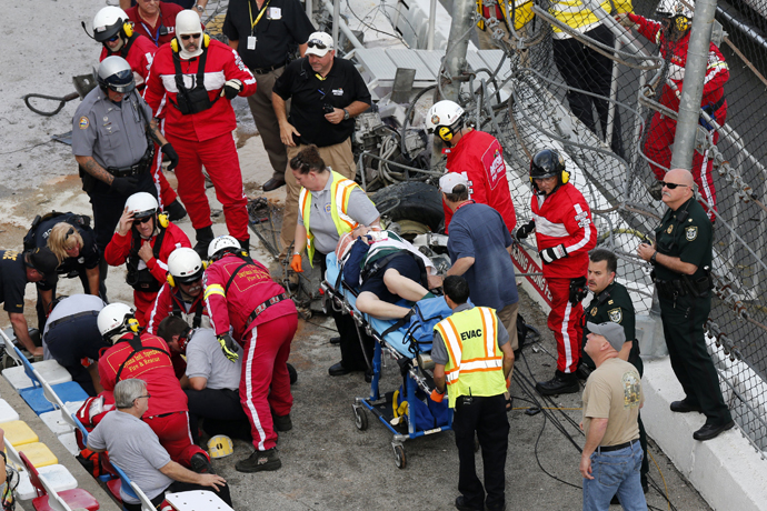 Rescue workers attend to the injured in the stands following a last-lap incident. (Reuters)