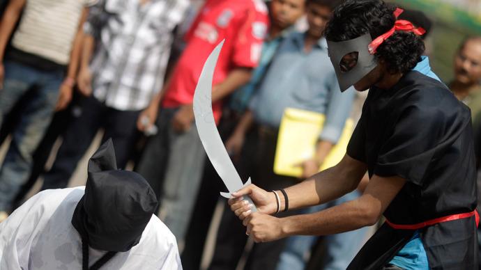 Demonstrators stage a mock beheading to protest the executions in Saudi Arabia (Reuters / Andrew Biraj )