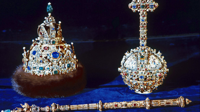 The imperial regalia of Russian Tsar Mikhail Romanov: The Hat of Vladimir Monomakh, scepter and orb featuring gold, precious stones and pearls on display at the Moscow Kremlin's Armory (RIA Novosti)