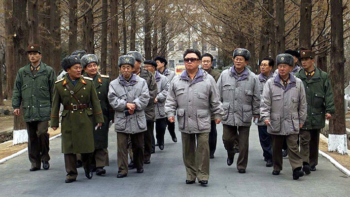 Accompanied by military officials, North Korean leader Kim Jong-Il (C) walks during an inspection tour of the Academy of Logistic Officers of North Korea at an undisclosed location in North Korea, 10 February 2003.(AFP Photo / KCNA via Korean News Service)