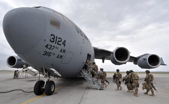 S Soldiers from the 234th Infantry Division, Fort Riley, Kansas board a plane to Afghanistan from the US transit center Manas 30kms from Bishkek (AFP Photo)