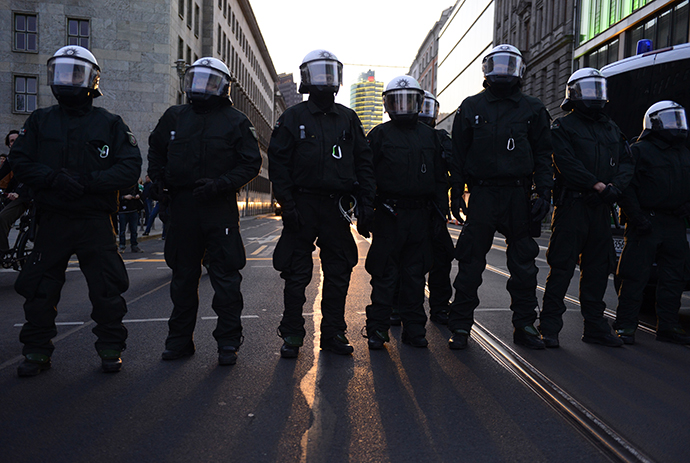 Policemen and policewomen stand on a street during the 'Revolutionary' May Day demonstration on May 1, 2013 in Berlin. (AFP Photo / John Mcdougall)