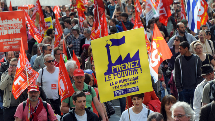 People take part in a demonstration on May 5, 2013 in Paris, called by Jean-Luc Melenchon, leader of Front de Gauche (Left Front) left wing party, to protest "against the austerity, against the finance and to ask for a Sixth Republic".  (AFP Photo)