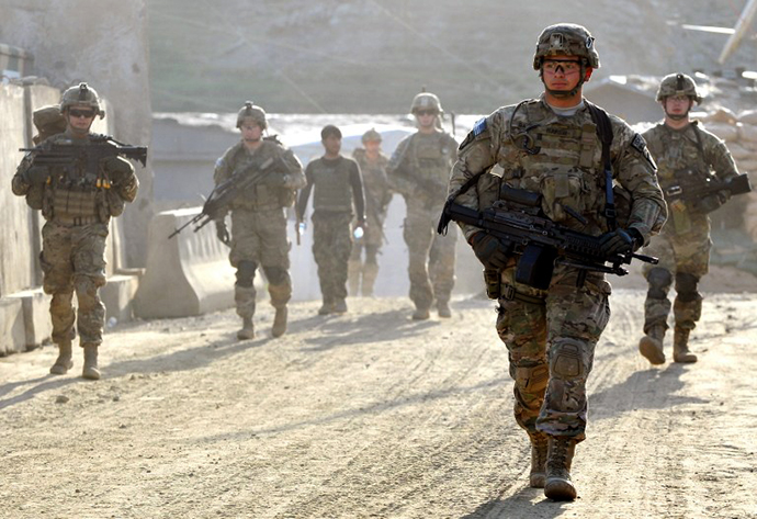 US army soldiers march from the Forward Base Honaker Miracle at Watahpur District in Kunar province. (AFP Photo / Manjunath Kiran)