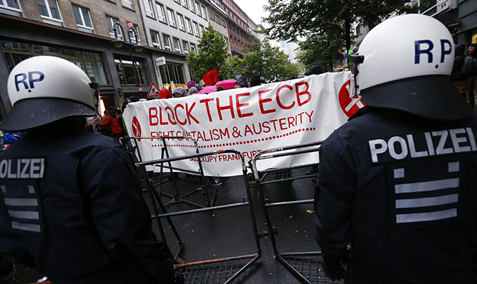 Police stand guard during an anti-capitalist "Blockupy" demonstration near the European Central Bank (ECB) headquarters in Frankfurt, May 31, 2013. (Reuters / Kai Pfaffenbach)