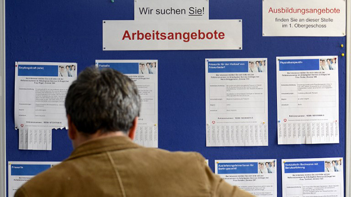 A man looking at ads for job vacancies at the employment centre "Agentur fuer Arbeit"  in Berlin. (AFP Photo / Odd Andersen)
