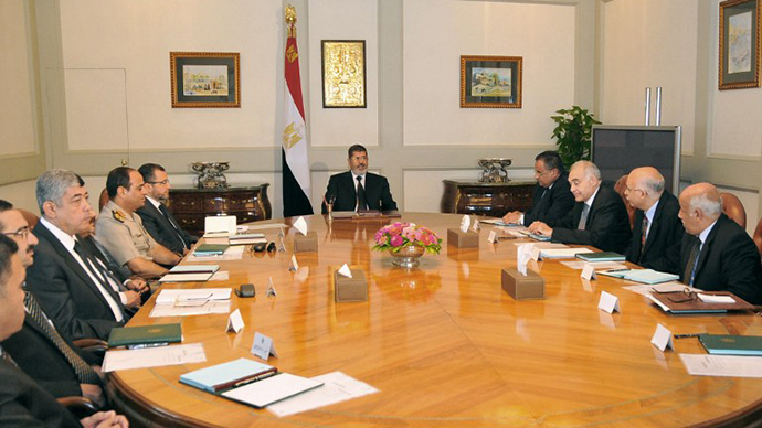 Egypt's President Mohammed Morsi holding a meeting on national security in Cairo (AFP Photo / Egyptian Presidency)
