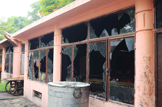 This image shows broken windows at the Bodh Gaya Buddhist temple complex after several low intensity explosions took place injuring two people on July 07,2013 (AFP Photo / STR)