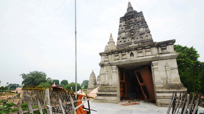 The entrance to a Budhist temple edifice at the Bodh Gaya Buddhist temple complex appears torn apart after several low intensity explosions took place injuring two people on July 07,2013 (AFP Photo / STR)