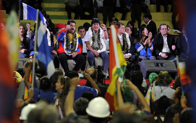 Bolivia's President Evo Morales (C) and his counterparts Nicolas Maduro (C left) of Venezuela and Rafael Correa (C, right) of Ecuador, are pictured during a welcoming gathering in honour of Morales, in Cochabamba, on July 4, 2013. (AFP Photo/Jorge Bernal)