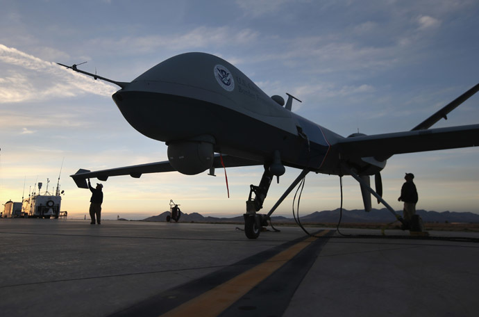 Maintenence personel check a Predator drone operated by U.S. Office of Air and Marine (OAM), before its surveillance flight near the Mexican border on March 7, 2013 from Fort Huachuca in Sierra Vista, Arizona. (John Moore/Getty Images/AFP)