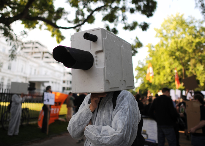 A demonstrator dressed up as a surveillance camera attenda a demonstration in support of U.S intelligence contractor Edward Snowden who leaked the US National Security Agenca (NSA) surveillance program, under the motto 'Stop Prism now!' in front of the US consulate in Hamburg, Germany (AFP Photo / DPA / Angelika Warmuth / Germany out) 