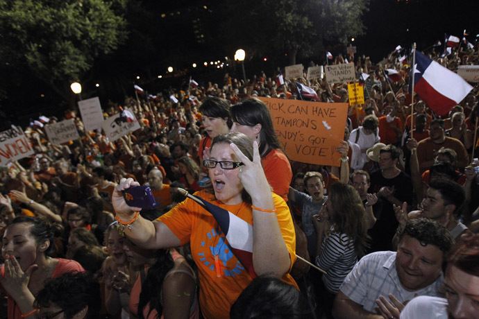 Abortion rights protesters rally after the state Senate passed legislation restricting abortion rights in Austin, Texas early July 13, 2013. (Reuters/Mike Stone)