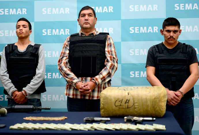  Ivan Velazquez Caballero, aka "Z 50" or "El Taliban" (C), senior leader in the Zetas drug cartel and member of the Gulf cartel, is presented to the press at the Mexican Navy headquarters in Mexico City (AFP Photo / Alfredo Estrella)