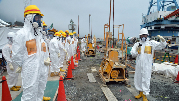 This photo taken on August 6, 2013 shows local government officials and nuclear experts inspecting a construction site to prevent the seepage of contamination water into the sea, at Tokyo Electric Power's (TEPCO) Fukushima Dai-ichi nuclear plant in Okuma, Fukushima prefecture (AFP Photo)
