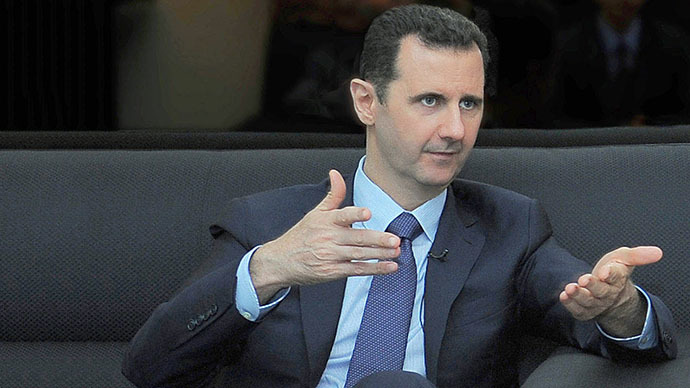 A handout picture released by the Syrian Arab News Agency (SANA) on August 26, 2013 shows Syrian President Bashar al-Assad giving an interview with Russian newspaper Izvestia in Damascus (AFP Photo)