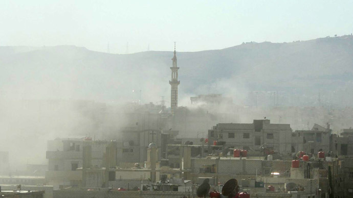 A handout image released by the Syrian opposition's Shaam News Network shows smoke above buildings following what Syrian rebels claim to be a toxic gas attack by pro-government forces in eastern Ghouta, on the outskirts of Damascus on August 21, 2013. (AFP/Shaam News Network)