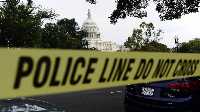 Police cordon off the US Capitol after shots fired were reported near 2nd Street NW and Constitution Avenue on Capitol Hill in Washington, DC, on October 3, 2013. (AFP Photo / Jewel Samad)