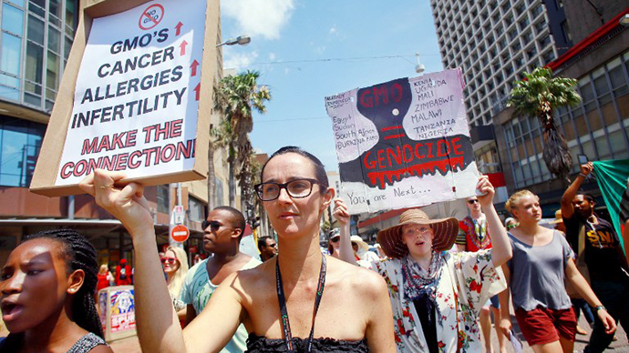 Activists carry signs during a protest against chemical giant Monsanto in Durban on October 12, 2013. (AFP Photo / Rajesh Jantilal)