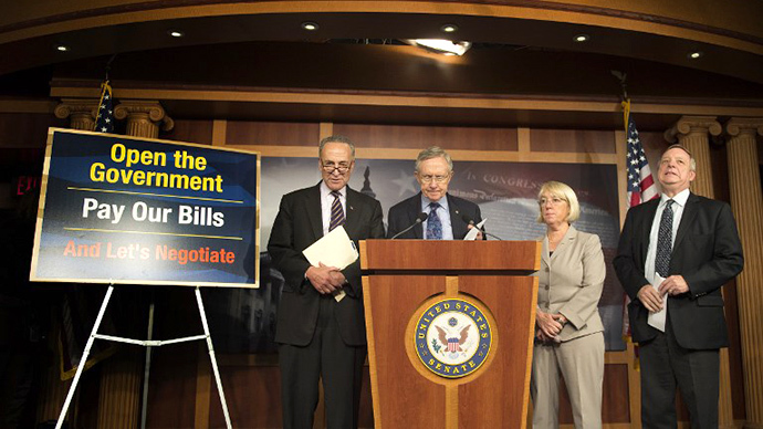 Senate Majority Leader Harry Reid, D-Nevada (2nd L) prepares to make a statement with US senators Chuck Schumer (L), D-New York, Patty Murray (2nd-R), D-Washington and Dick Durbin, D-Illinios, during a press conference on Capitol Hill about the debt ceiling in Washington, DC, October 12, 2013. (AFP Photo / Jim Watson)