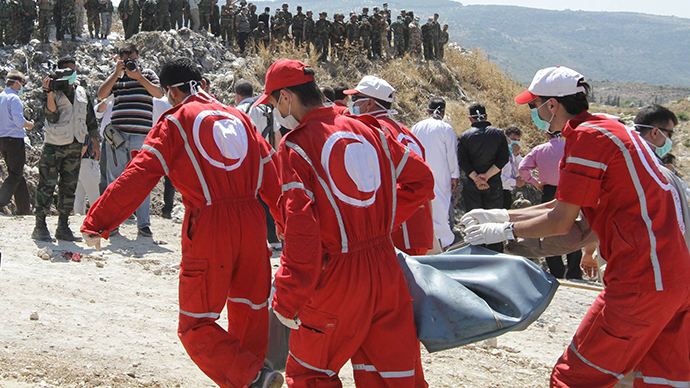 Syrian Arab Red Crescent volunteers at work. (AFP Photo / Louai Beshara)