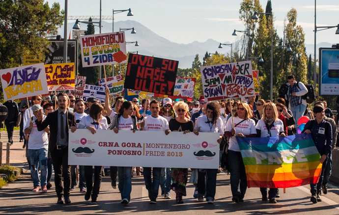 Gay-rights supporters, including a number of human rights activists, walk during the Pride March in Podgorica, October 20, 2013 (Reuters / Stevo Vasiljevic)