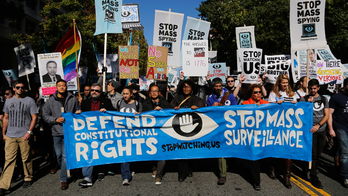 Demonstarators carry signs at "Stop Watching Us: A Rally Against Mass Surveillance" march near the U.S. Capitol in Washington, October 26, 2013. (Reuters / Jonathan Ernst) 
