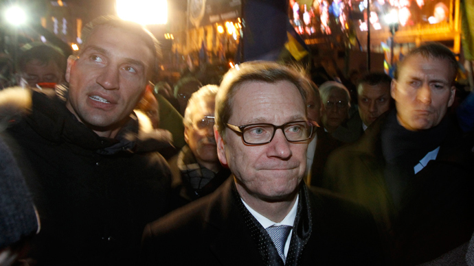 German Foreign Minister Guido Westerwelle (C) and heavyweight boxing champion and UDAR (Ukrainian Democratic Alliance for Reform) party leader Vitali Klitschko (L) walk along Independence Square in Kiev December 4, 2013.  (Reuters / Vasily Fedosenko)