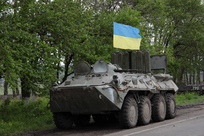  A Ukrainian flag flies on a armored military vehicle at a checkpoint near the eastern Ukrainian city of Slavyansk .(AFP Photo / Sergey Bobok )