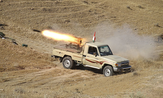 A vehicle belonging to Kurdish security forces fires a multiple rocket launcher during clashes with Sunni militant group Islamic State of Iraq and the Levant (ISIL) on the outskirts of Diyala June 14, 2014. (Reuters / Yahya Ahmad)