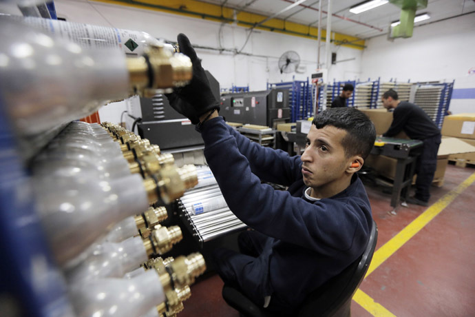 A Palestinian employee works at the SodaStream factory in the West Bank Jewish settlement of Maale Adumim January 28, 2014. (Reuters/Ammar Awad)