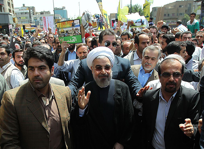 A handout picture released by the official website of the Iranian President Hassan Rouhani shows him attending Quds (Jerusalem) Day demonstration in Tehran on July 25, 2014. (AFP Photo)