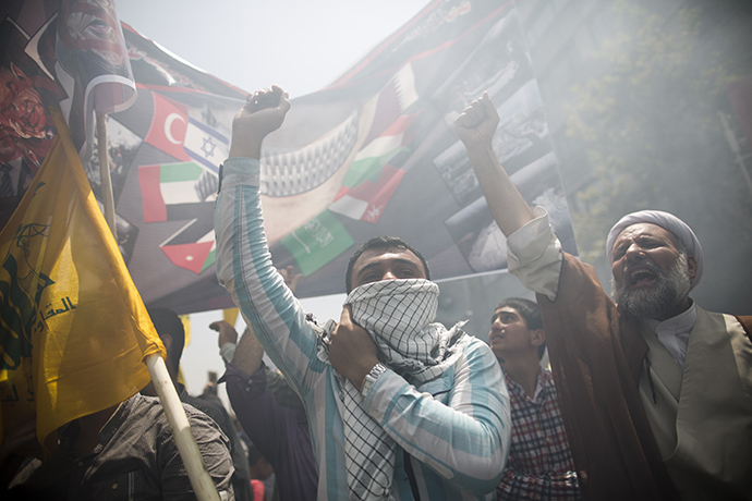 Iranians chant anti-Israeli slogans during a demonstration in Tehran on July 25, 2014 to mark Quds (Jerusalem) Day. (AFP Photo / Behrouz Mehri)