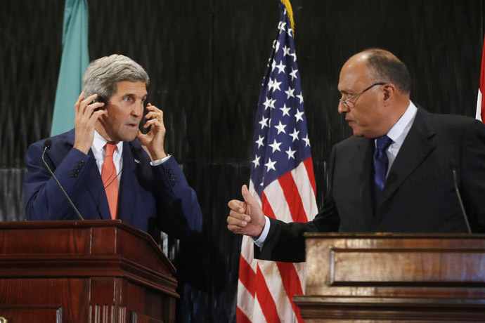 U.S. Secretary of State John Kerry (L) looks at Egypt's Foreign Minister Sameh Shukri during a news conference at a hotel in Cairo July 25, 2014. (Reuters)