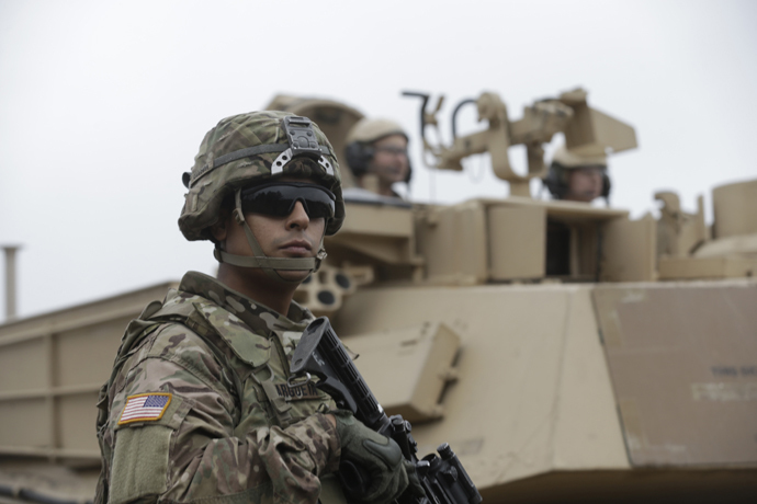 U.S. soldiers deployed in Latvia perform during a drill at Adazi military base October 14, 2014. (Reuters / Ints Kalnins)