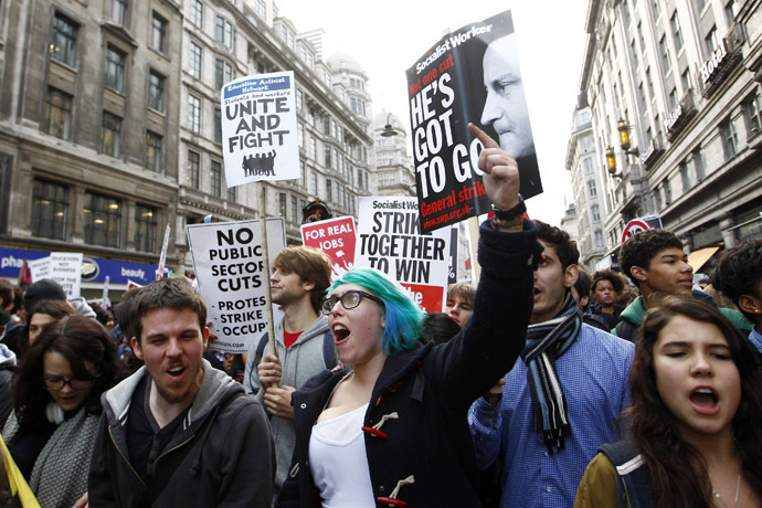 Demonstrators march through central London November 9, 2011. Thousands of students marched through London on Wednesday in the latest display of anger against the Conservative-led government's austerity measures. (Reuters/Andrew Winning)