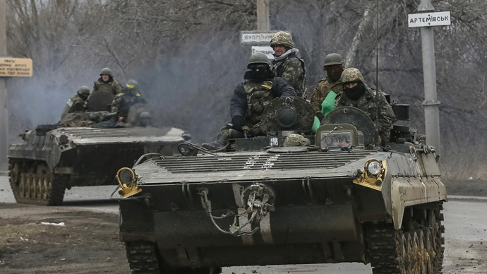 Members of the Ukrainian armed forces ride on armoured personnel carriers near Artemivsk, eastern Ukraine, March 3, 2015. (Reuters/Gleb Garanich)