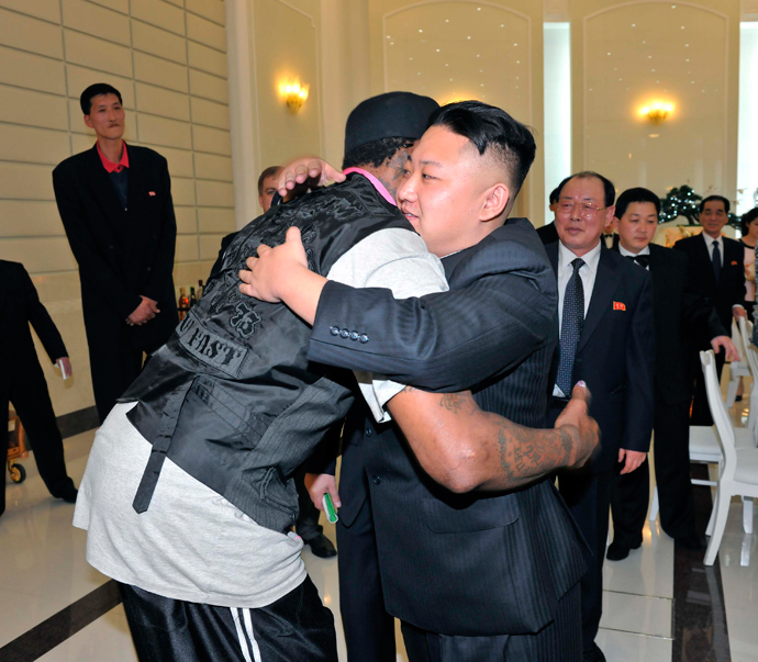North Korean leader Kim Jong-Un and former NBA basketball player Dennis Rodman (front L) hug in Pyongyang on March 1, 2013 (Reuters / KCNA)
