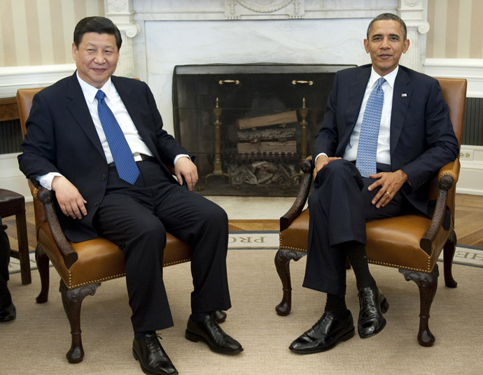 Barack Obama and Xi Jinping speak during meetings in the Oval Office of the White House in Washington, DC, February 14, 2012.  (AFP Photo/Saul Loeb)