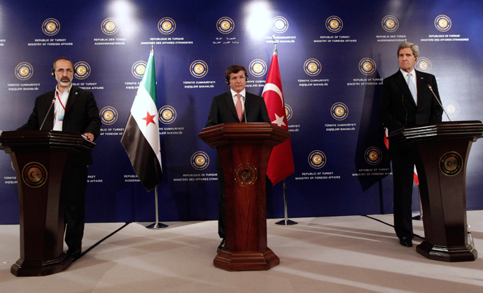 Turkish Foreign Minister Ahmet Davutoglu (C), U.S. Secretary of State John Kerry (R) and Syrian opposition leader Moaz al-Khatib attend a news conference after the Friends of Syria meeting in Istanbul April 20, 2013 (Reuters / Osman Orsal)