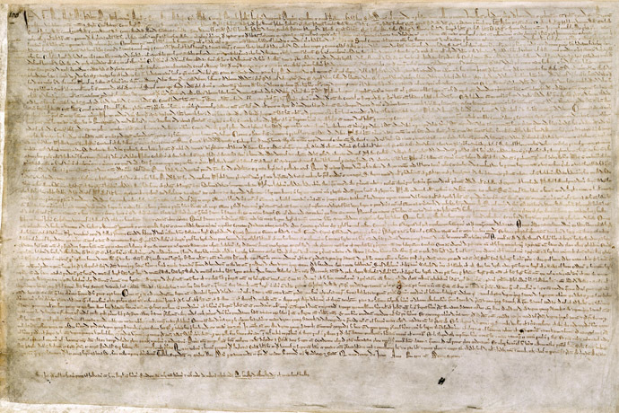 The Magna Carta (originally known as the Charter of Liberties) of 1215, written in iron gall ink on parchment in medieval Latin, using standard abbreviations of the period, authenticated with the Great Seal of King John. The original wax seal was lost over the centuries. This document is held at the British Library and is identified as The British Library, Cotton MS. Augustus II. 106. (Photo from wikipedia.org)