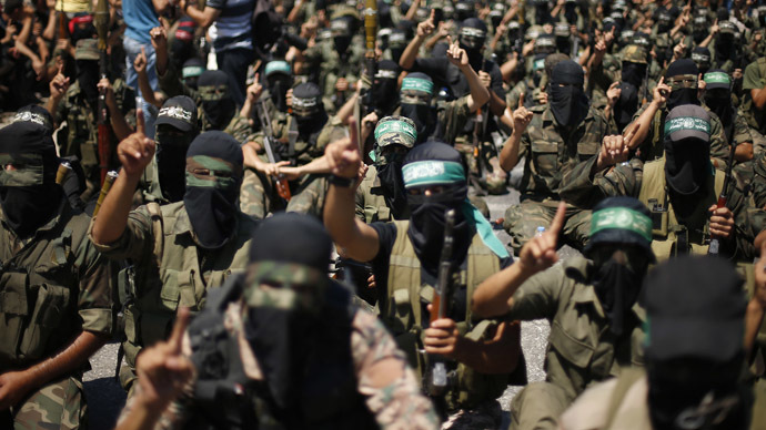 Palestinian militants take part in a protest against peace talks between Israel and the Palestinians, as well as possible U.S. attacks on Syria, in the northern Gaza Strip September 6, 2013. (Reuters)