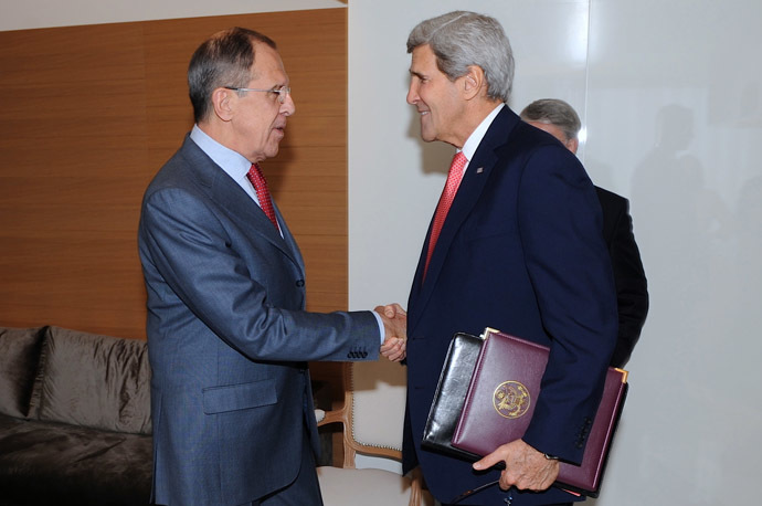In this image released by the US State Department, US Secretary of State John Kerry (R) shakes hands with Russian Foreign Minister Sergey Lavrov before a bilateral meeting on the margins of talks focused on Iran's nuclear capabilities, Geneva, Switzerland, on November 23, 2013. (AFP/US State Department)