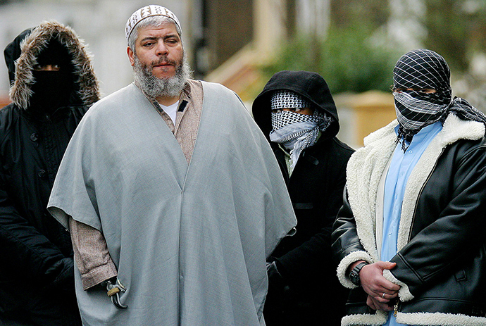 ARCHIVE PHOTO: A file photograph dated February 7, 2003 shows Muslim cleric Sheikh Abu Hamza (2L) outside the North London Mosque at Finsbury Park surrounded by supporters (Reuters)