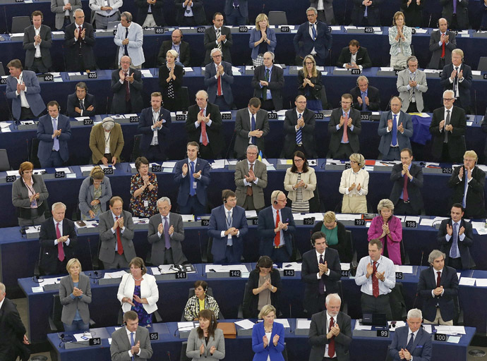 Members of the European Parliament stand to applaud during a voting session on the EU-Ukraine Association agreement at the European Parliament in Strasbourg, September 16, 2014. (Reuters/Vincent Kessler)