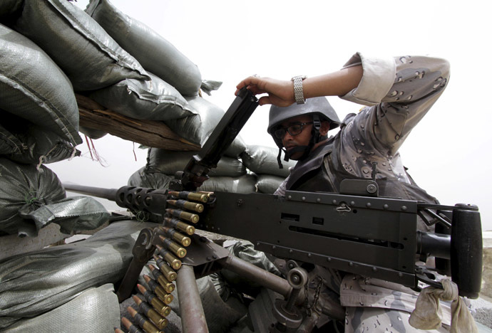 A Saudi soldier loads ammunition at their position at Saudi Arabias border with Yemen April 6, 2015. (Reuters/Faisal Al Nasser)