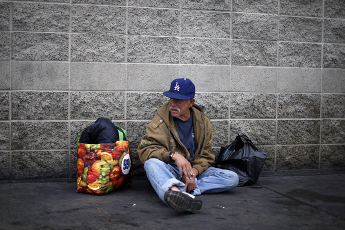 Homeless U.S. army Vietnam War veteran Frank Victor, 63, smokes a cigarette on skid row in Los Angeles on Veterans Day, California (Reuters/Lucy Nicholson)