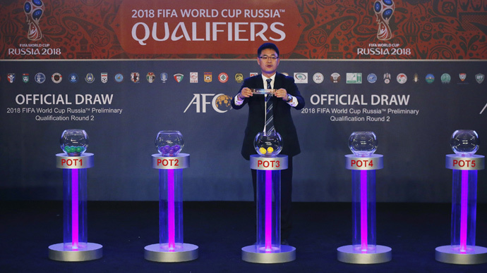 Asian Football Confederation's Shin Man Gil draws Afghanistan for Group E in the 2018 FIFA World Cup Asian qualifiers during the preliminary joint qualification round 2 draw in Kuala Lumpur, April 14, 2015. (Reuters / Olivia Harris)
