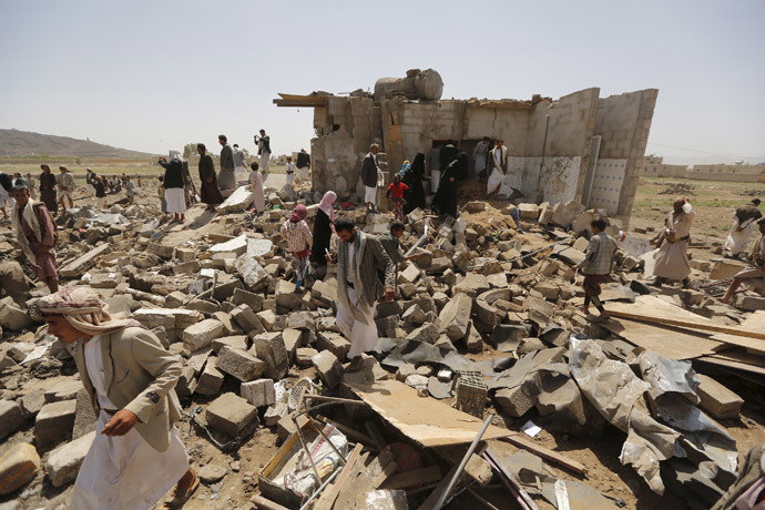 People gather on the rubble of houses destroyed by a Saudi-led air strike near Yemen's capital Sanaa June 3, 2015. (Reuters/Khaled Abdullah)