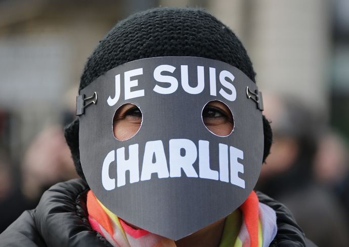 A women wearing a mask reading "I am Charlie" takes part in a solidarity march (Marche Republicaine) in the streets of Paris January 11, 2015. (Reuters / Eric Gaillard)